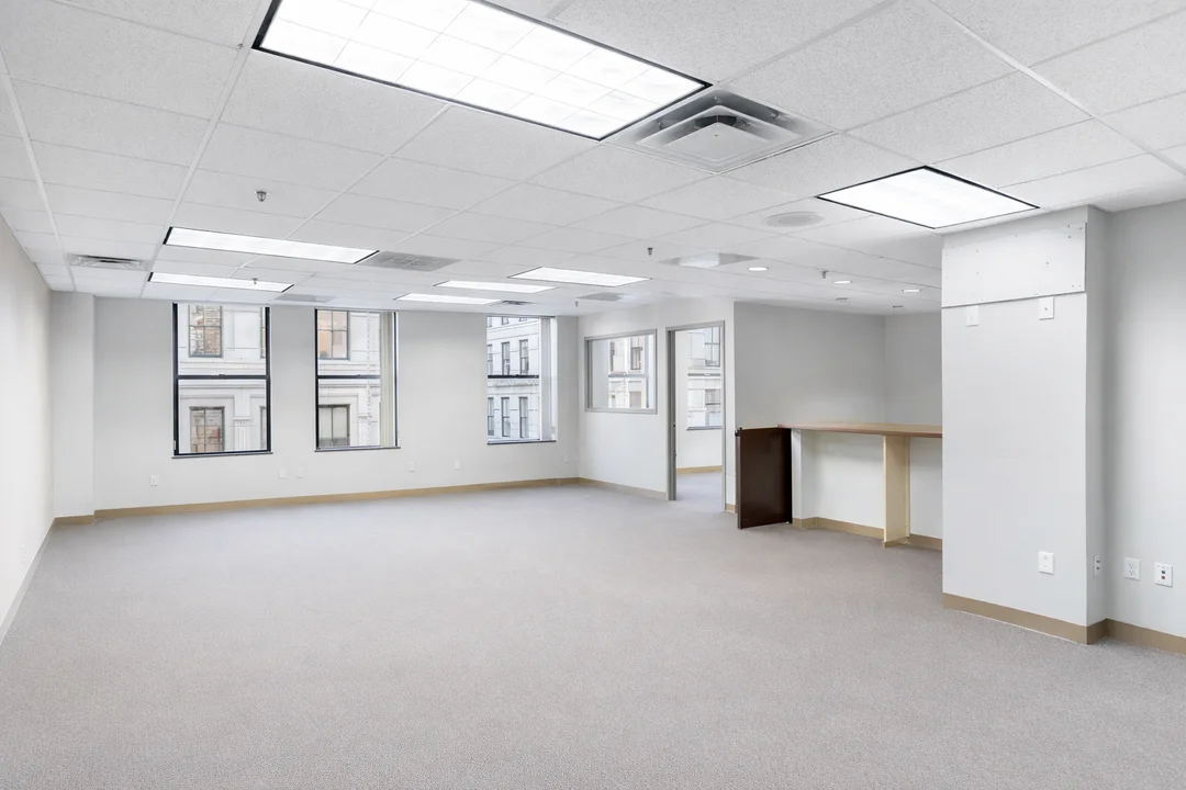 Move-in-ready commercial office space with natural light, open layout, and flexible workspace potential.